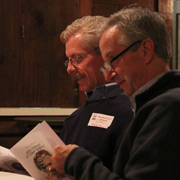 Dan and Jim studying the Official AONE Holiday Songbook